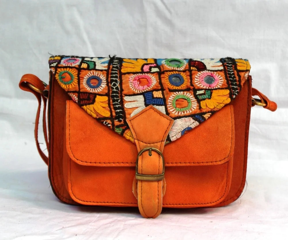 Vintage ethnic leather crossbody bag with colorful embroidery and orange suede, perfect for stylish women.