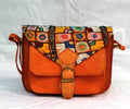 Vintage ethnic leather crossbody bag with colorful embroidery and orange suede, perfect for stylish women.
