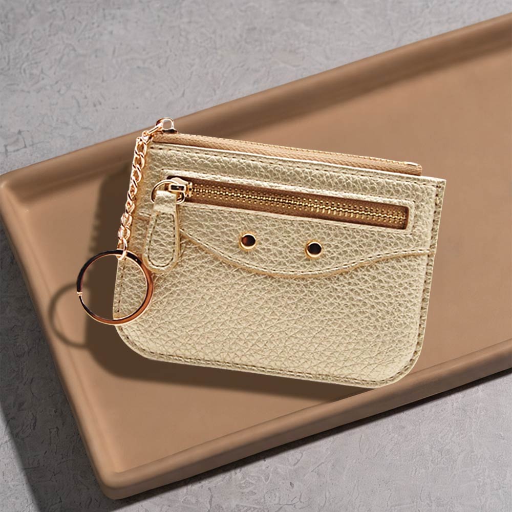 Slim faux leather card holder with key ring in gold color, featuring zip pockets and card slots, stylish and compact.