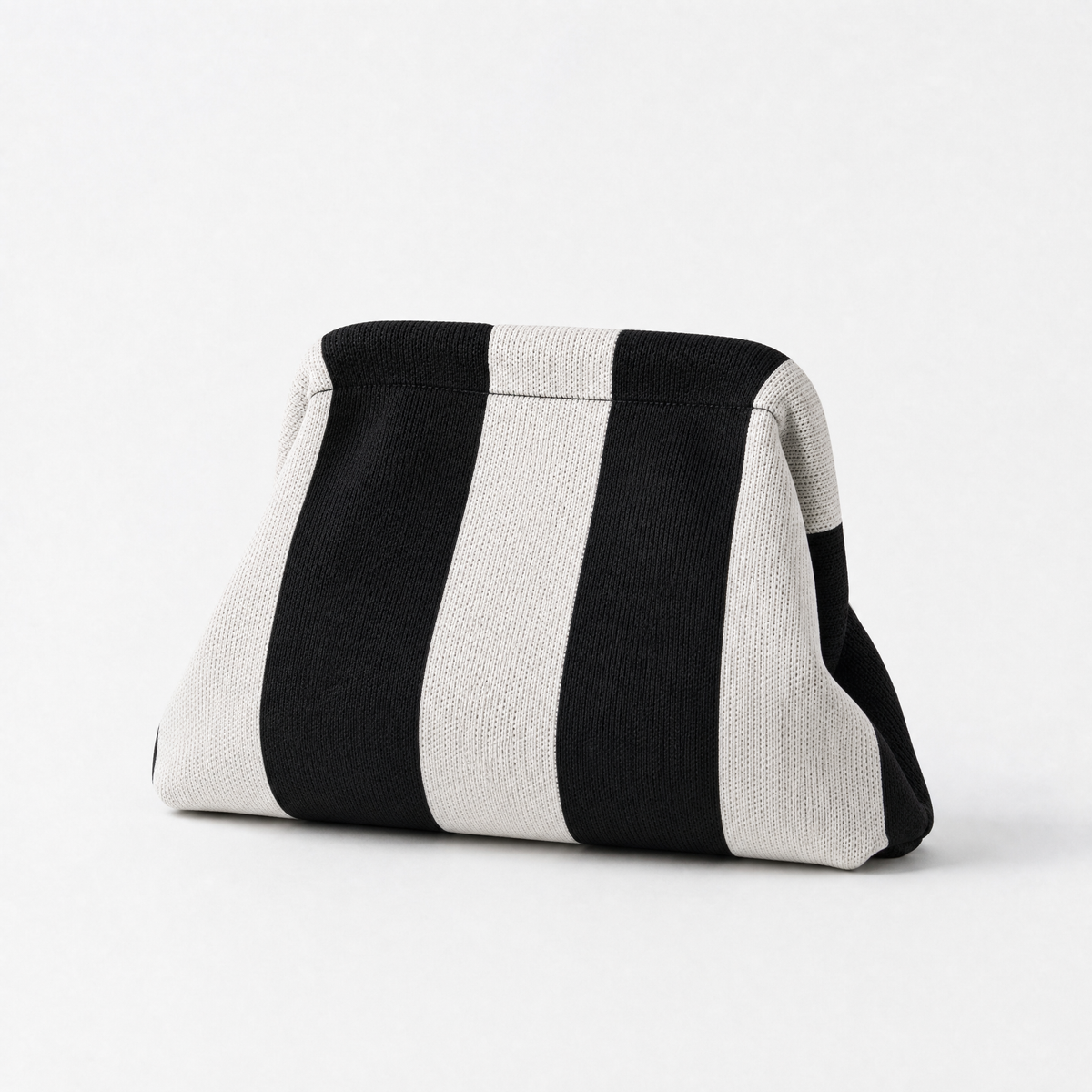 machine washable everywhere clutch in black and white stripes, perfect for versatile styling and easy cleaning.