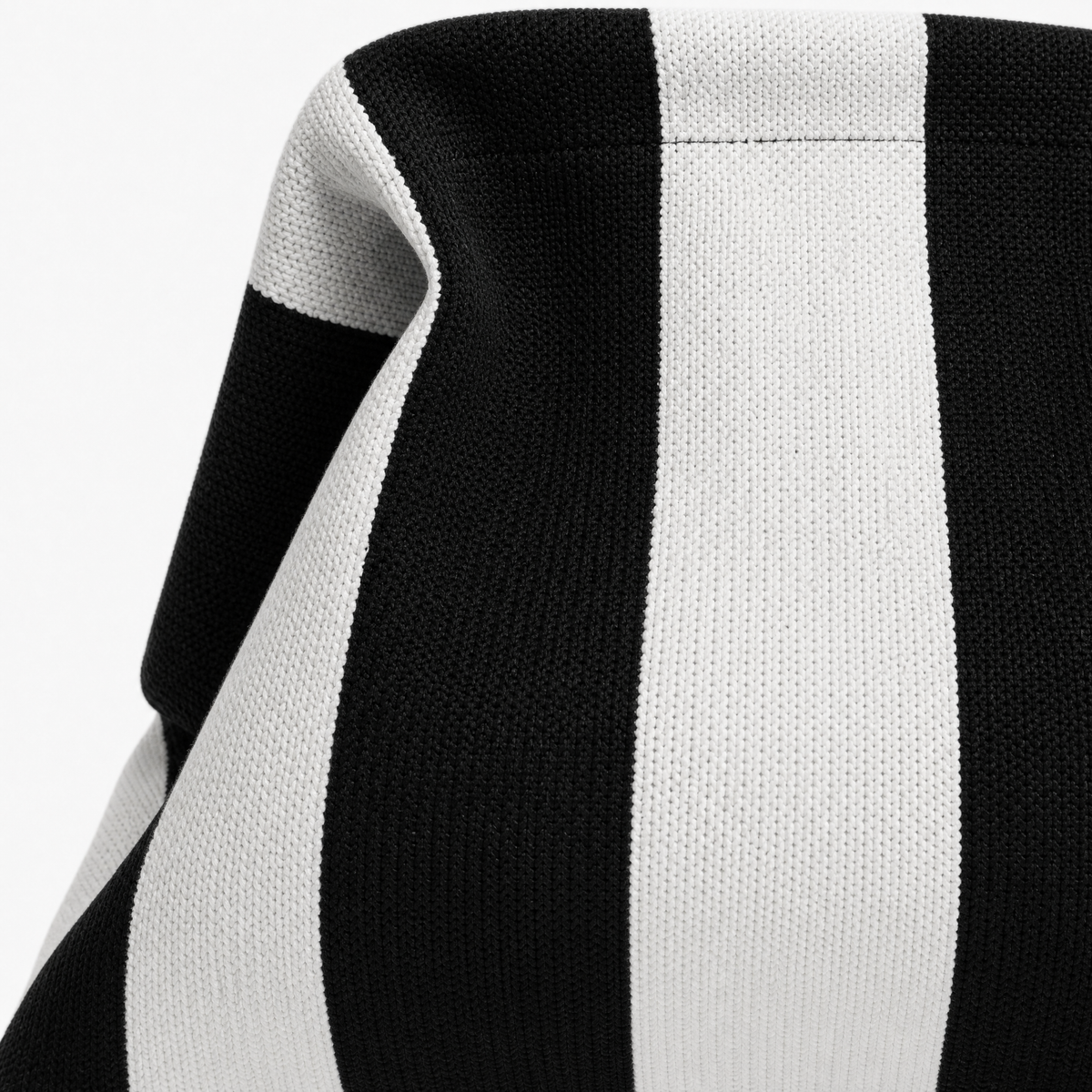 Stylish black and white striped machine washable everywhere clutch fabric close-up, perfect for all occasions.