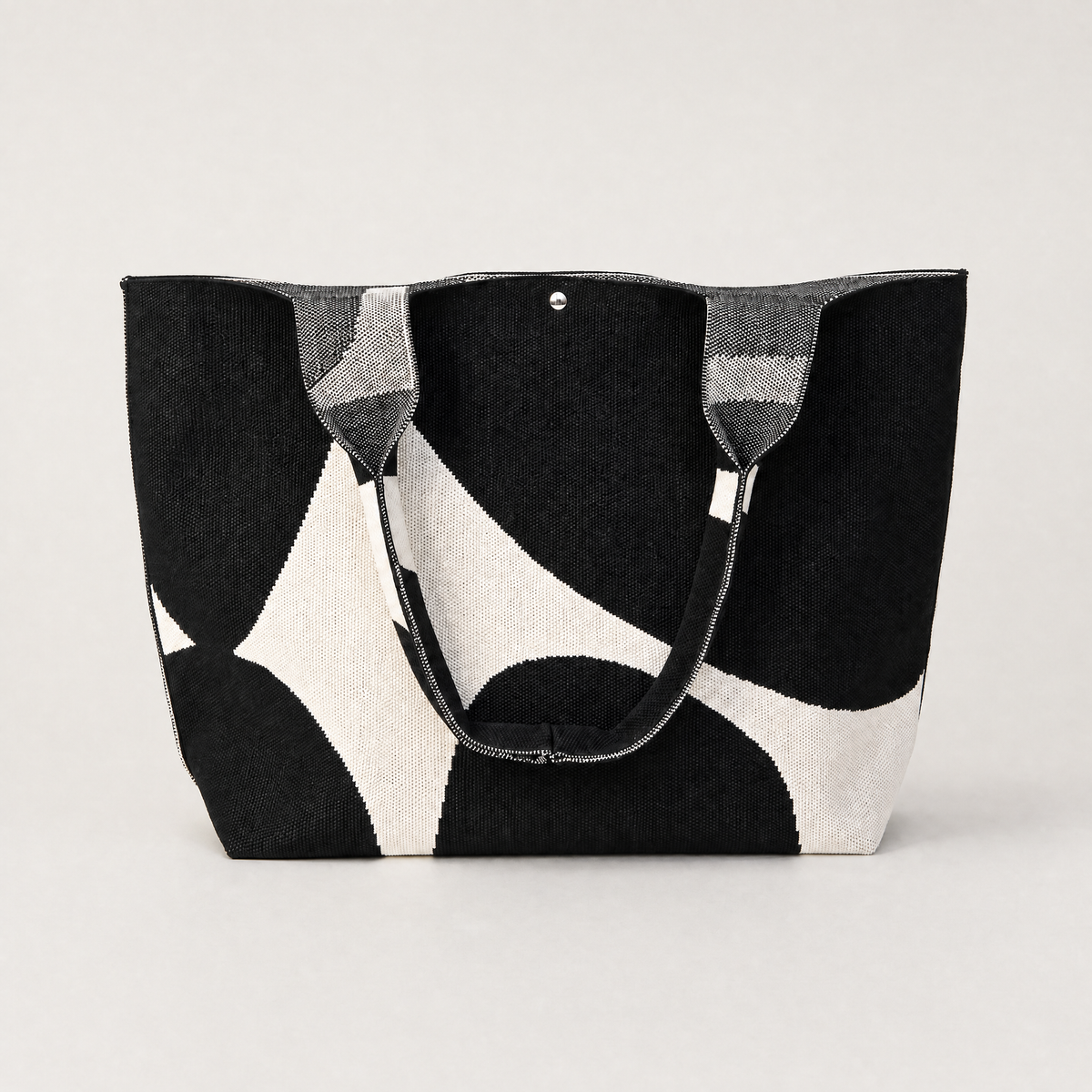 MOOdy Black Signature Tote bag featuring a stylish black and white patterned design.