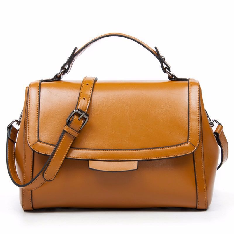 Genuine leather shoulder handbag in earthy yellow color with a cover wrapping design and convenient shoulder strap.