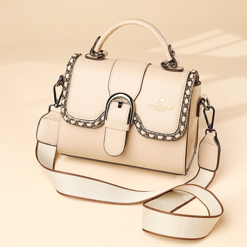 luxury PU shoulder bag for women with chain detail and adjustable strap in light beige color.